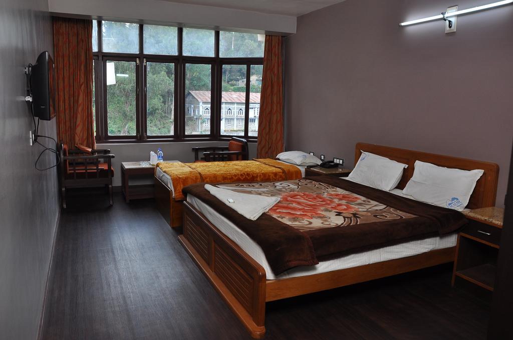 Grand Paradise Inn Kodaikanal Rum bild