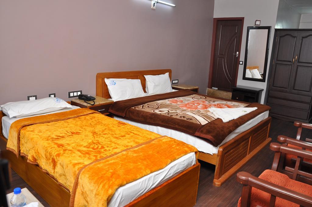 Grand Paradise Inn Kodaikanal Rum bild