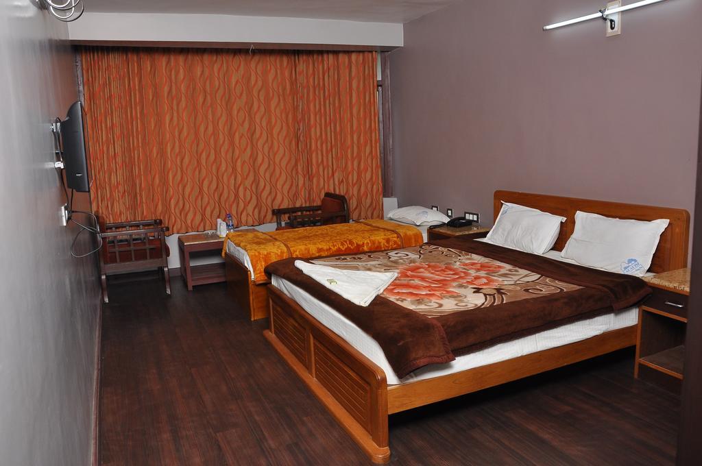 Grand Paradise Inn Kodaikanal Rum bild
