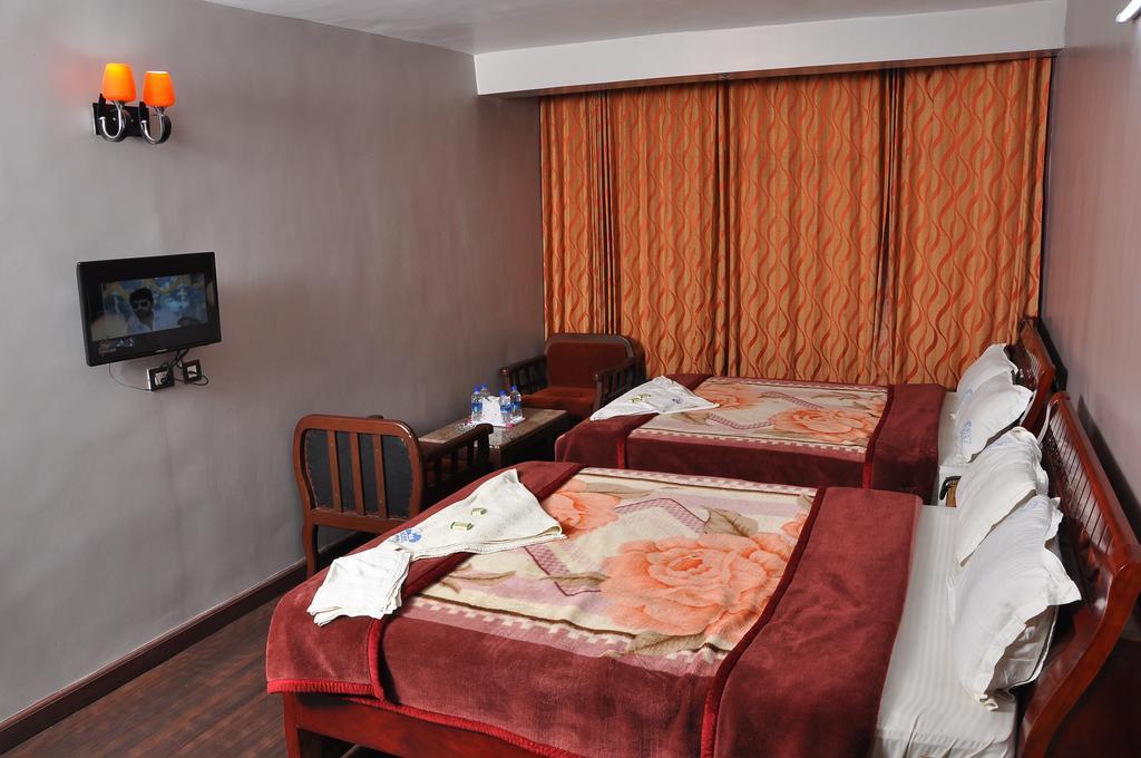 Grand Paradise Inn Kodaikanal Rum bild